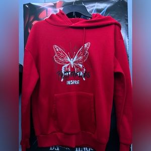 Red Hoodie with butterfly design.
